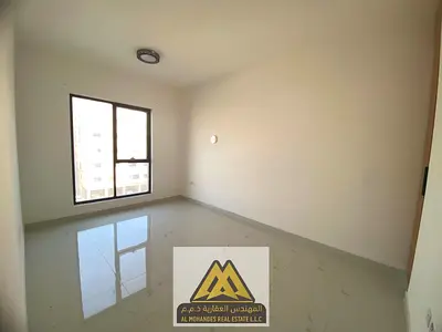 Annual Rent: Spacious 1-bedroom apartment in Al Hamidiya, second tenant, panoramic open view, free parking, prime location, AED 34,997, payable in 4 o