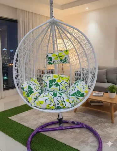 White Rattan Hanging Egg Chair with Green Floral Cushions