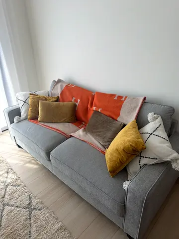 Light grey 3-seater fabric sofa with cushions