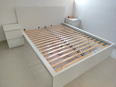 Ikea White double bed frame with slatted base and two matching nightstands