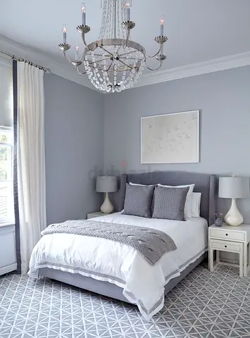 Gray upholstered double bed with headboard