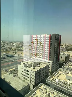 2BR with hall for annual rent in Garden City Towers Ajman, 2 bathrooms, excellent finishes, strategi