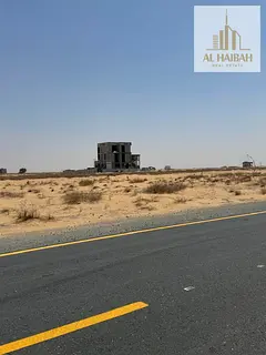 Two adjacent residential plots for sale in Sharjah, Rawdat Al Qurt area, prime location.