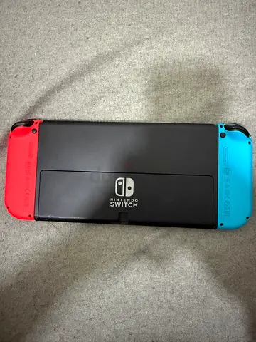 Nintendo Switch console with red and blue Joy-Cons - used