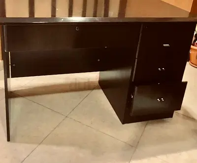 Dark brown wood office desk with 3-drawer pedestal and central drawer