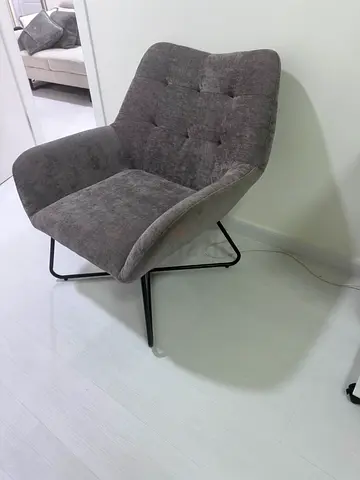 Grey modern accent lounge chair with metal base - good condition
