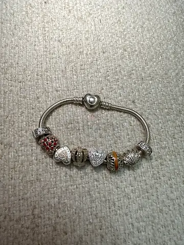 Pandora charm bracelet with multiple decorative beads (used)