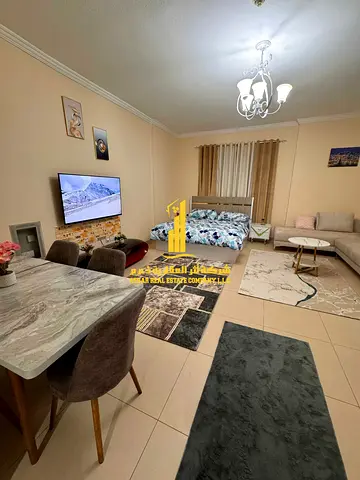 Largest furnished studio apartment with separate kitchen and open view for monthly rent in Ajman - Al Jurf 2 - Al Yasmin Towers