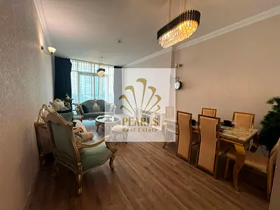 Luxury furnished 2-bedroom apartment in Al Rashidiya 1, Ajman, Al Waha Towers. Open view, 2 baths, gym, pool, parking. Rent AED 60K yearly, 4 payments
