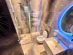 One of the finest finishes in Ajman: card entry system, central air conditioning, and a master bedro