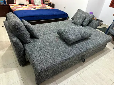 Comfortable Sofa Bed with Hidden Storage
Elegant three-seater sofa featuring soft cushions, durable