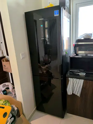 Black double-door refrigerator with freezer - good condition Available 14th Aug