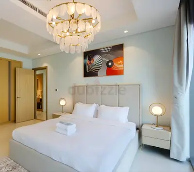 Modern upholstered king bed with headboard and mattress and two bedside tables