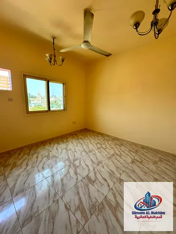 "Exclusive 1BR with balcony in Al Nasserya! Split AC, central gas & free parking. Easy payments. Pr