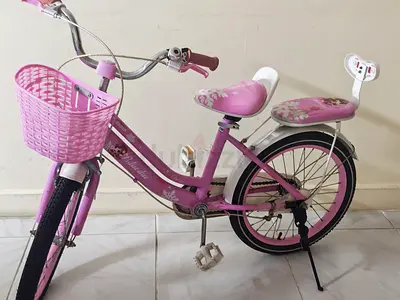 Pink kids' 18-inch bicycle with basket and rear seat - good condition