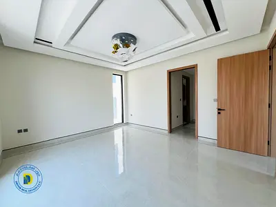 Luxury modern villa with 6 bedrooms, elevator, swimming pool, and rooftop terrace, fully air-conditioned, prime location.