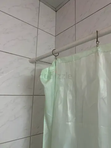 Light green shower curtain with adjustable fixing rod