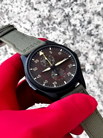 This IWC Pilot's Watch Chronograph Top Gun Miramar features an anthracite dial with red accents and