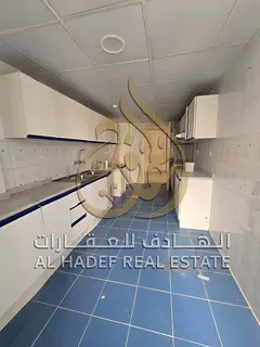 Official bachelor apartment for annual rent in Al Majaz 3, Sharjah. Two bedrooms and a spacious livi