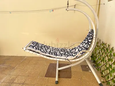 White Curved Metal Hanging Lounger Chair with Cushions. Used fair condition
