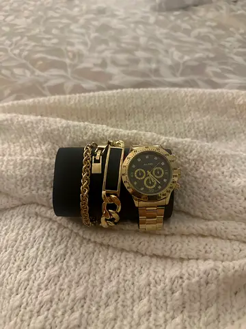 Gold-tone men's chronograph watch with matching bracelets