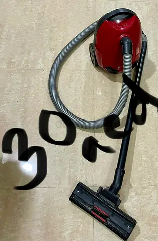 Red canister vacuum cleaner - working condition