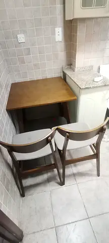 Solid wood corner dining table — -2 chairs, compact 4-seater, good condition