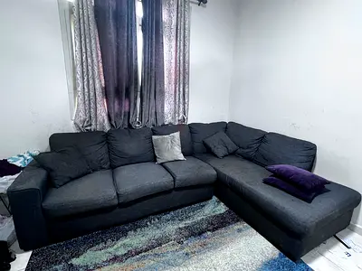 Dark grey L-shaped corner sofa 5 seater - good condition but require cleaning..