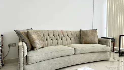 Light grey-green 3-seater tufted fabric sofa in good condition