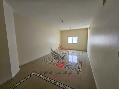 2BR apartment with balcony, both master bedrooms, open view, prime location near Al Safiya Park & all essential services.