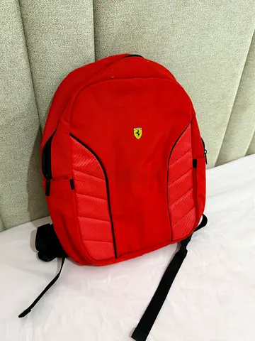 Red casual backpack in good used Ferrari condition