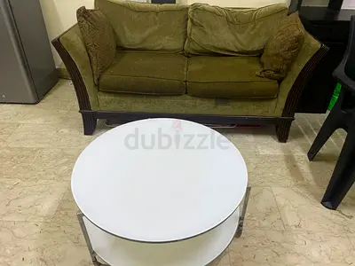 Olive Green Two Seater Sofa and White Round Coffee Table