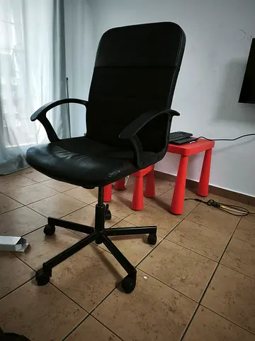 Black swivel office chair with armrests - good condition