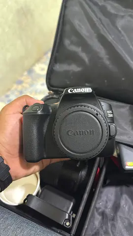 Canon EOS 250d DSLR body with grip — used, good condition