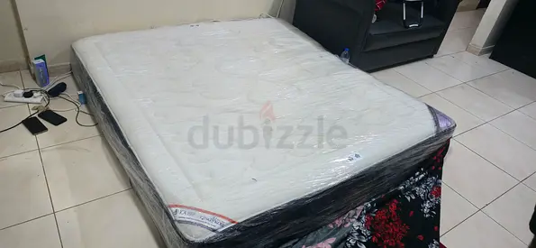 Queen mattress in good condition — lightly used, clean and wrapped