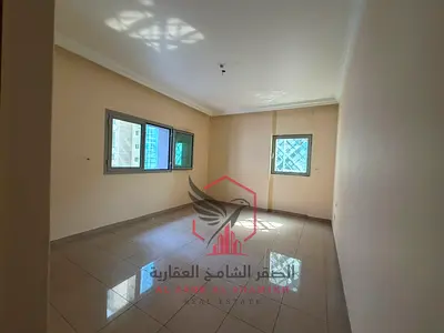 Largest two-bedroom apartment with free AC, parking, free gym and pool, open view, and two balconies for rent in Al Majaz 3.