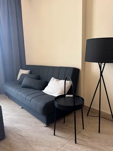 Convertible dark grey fabric sofa bed