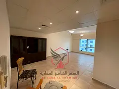 Beautiful two-bedroom apartment with a living room, free AC, parking, gym, free swimming pool, built