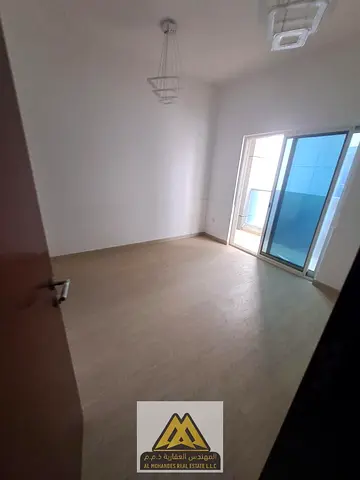 One bedroom and a spacious living room Two bathrooms Balcony with open views of Sharjah Free parkin