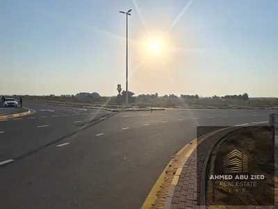Land for Sale in Basateen Al Serra, Umm Al Quwain | 1,938 sq ft plot in a prime location, second plot from the corner, close to all services, AED 370,