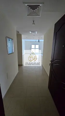 Spacious one-bedroom apartment with a living room and balcony, close to the Ajman Corniche.