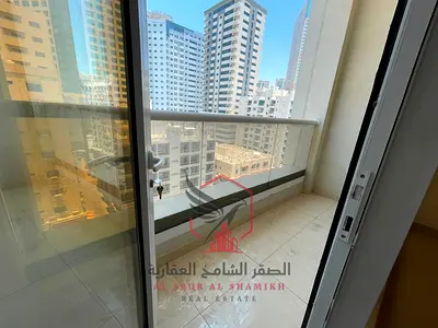 Apartment for annual rent - Al Majaz 2. Two master bedrooms with balcony, free parking, spacious areas, open view, free maintenance, central air