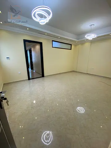 Three-bedroom apartment with a living room in Al Rawda Ajman for annual rent Highend finishes in a luxury building with free maintenance throughout