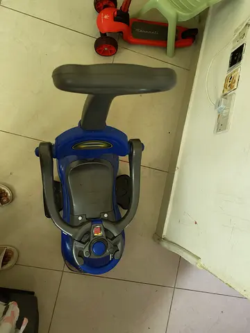Blue sit-and-ride toddler car toy with steering wheel — good used condition