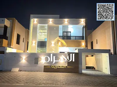 Luxury villa for sale in Al Yasmin with a modern design, including air conditioning.