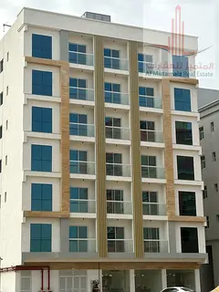Two-bedroom apartment, hall, and 3 bathrooms in Al Jurf Industrial Area 3, first-inhabitant building