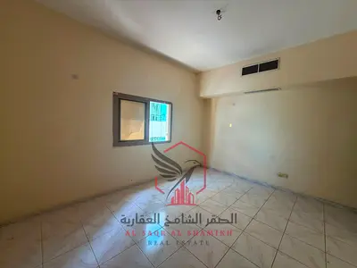 **2-bedroom apartment with living room, central A/C, central gas, free maintenance, wide hall, built-in wardrobes, family tower, near King Faisal St.
