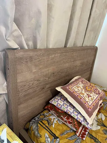 Queen wooden headboard in light oak finish - good condition