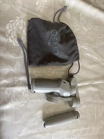 DJI Osmo Mobile Gimbal with pouch and mini tripod - good condition. No clamp included for phone