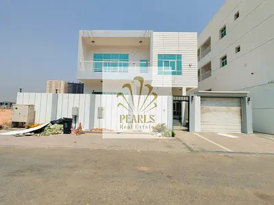 Luxury villa for annual rent in Al Aamra Ajman, 4 bedrooms, 2 living rooms, majlis, maid room, 6 bathrooms, central AC, large equipped kitchen, 100,00